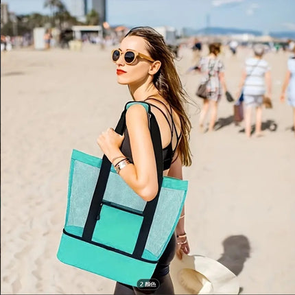 An women holding the extra large beach bag