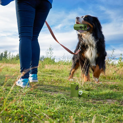 Dog poop bag dispenser attached to leash