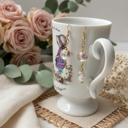 Gold plated dangle earrings with glass roses