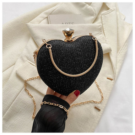 Black color heart-shaped shiny clutch bag
