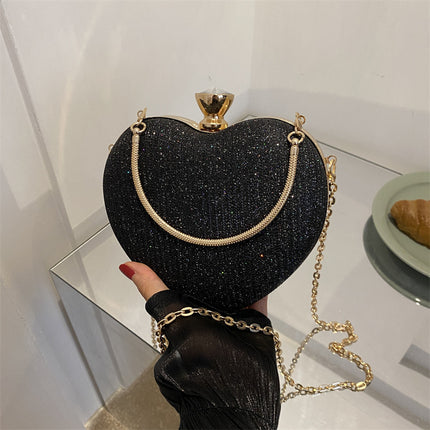 Black heart-shaped shiny clutch bag