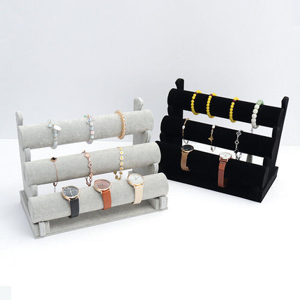 Bracelets and watches organized on velvet 3-tier display stand