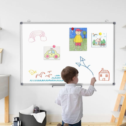 Kids drawing on magnetic whiteboard