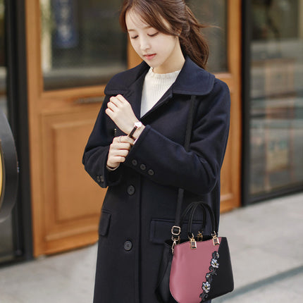 Ladies wearing floral handbag