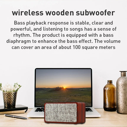 Q2 wooden Bluetooth speaker on desk