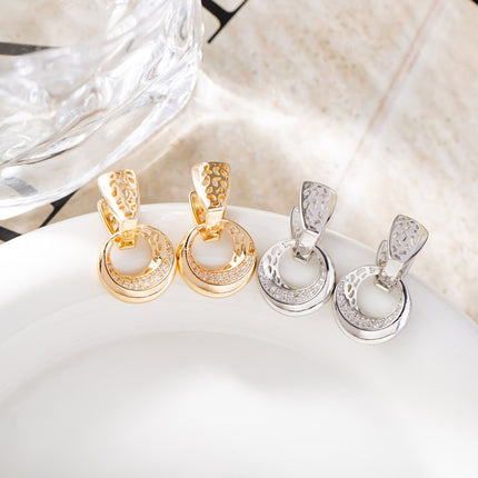 Silver hollow moon earrings with zircon flower