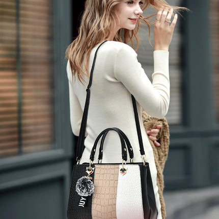 Woman wearing Wave women handbag as shoulder bag showing elegant and stylish design