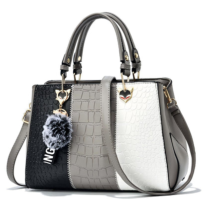 Front view of Wave women handbag showing wave design and PU leather