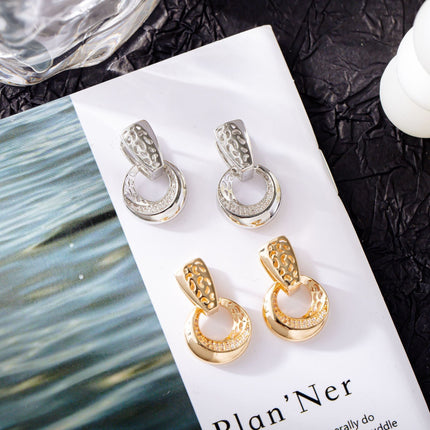 Drop earrings with natural zircon flower inlay